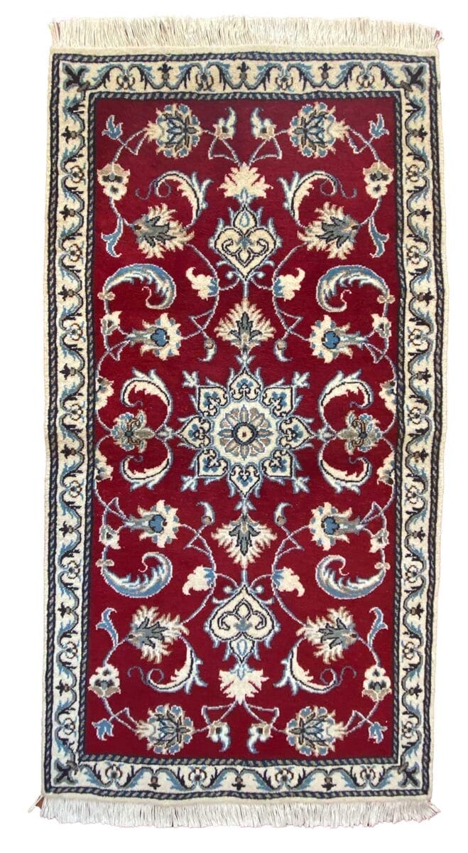 Un tappeto Tappeto con disegni floreali Nain 169 in rosso e blu.