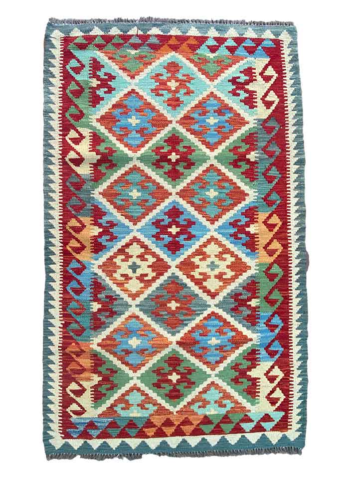 Galleria Tabriz - Tappeti in vendita. Un tappeto Bozza automatica con motivi geometrici colorati, forme a diamante e bordo sfrangiato.
