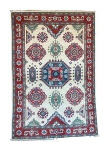 Galleria Tabriz - Tappeti in vendita. Un tappeto tradizionale con motivi geometrici Bozza automatica in rosso, blu e verde su sfondo beige.