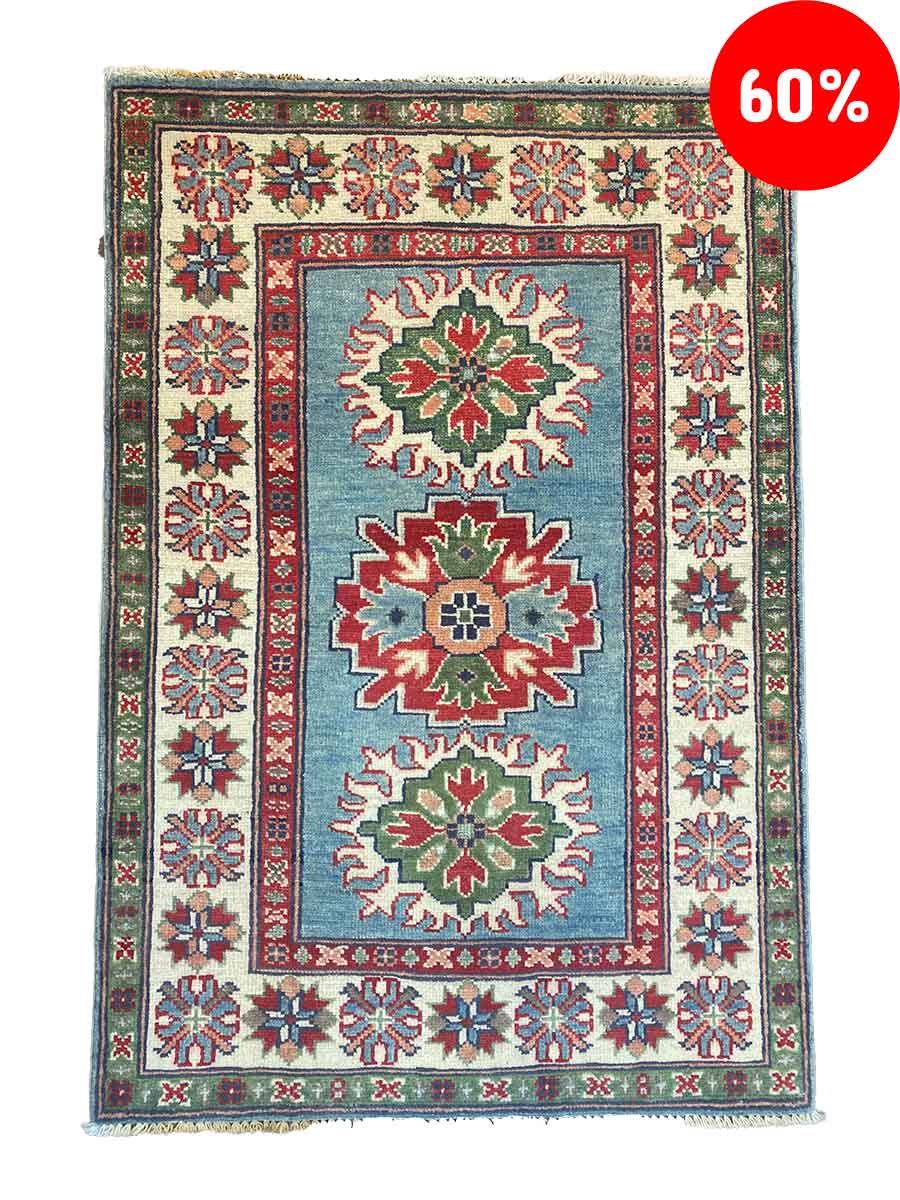 Galleria Tabriz - Tappeti in vendita. Un tappeto colorato con motivi geometrici, prevalentemente in rosso, verde e blu. Una bozza automatica di tonalità vivaci decora il disegno e un cerchio rosso nell'angolo in alto a destra mostra "60%".