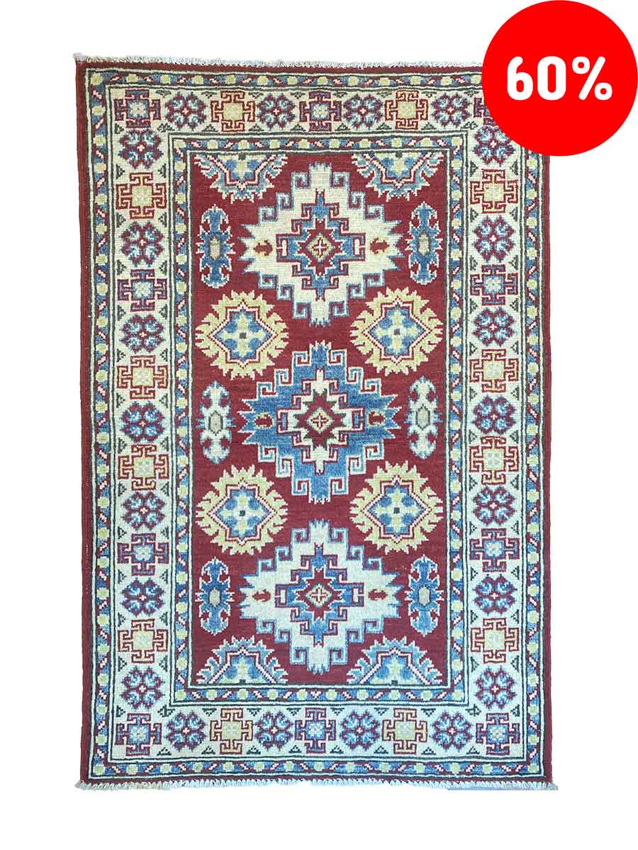 Galleria Tabriz - Tappeti in vendita. Un tappeto a motivi rossi con disegni geometrici blu e bianchi รจ elegantemente drappeggiato sul pavimento, emanando un fascino bozza automatica. Nell'angolo in alto a destra, un cerchio rosso in grassetto mostra un allettante sconto del "60%".