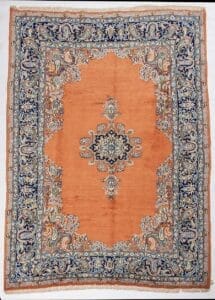 Galleria Tabriz - Tappeti in vendita. Tappeto persiano ornato con centro arancione, bordo floreale blu e intricato disegno a medaglione al centro: un vero capolavoro per il vostro spazio.
