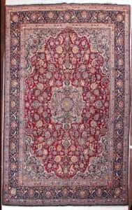 Galleria Tabriz - Tappeti in vendita. Tappeto persiano Kashan rosso e blu con intricati motivi floreali e bordi ornati, visto dall'alto.