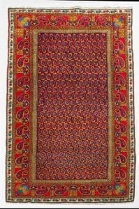 Galleria Tabriz - Tappeti in vendita. Un colorato tappeto persiano ispirato al Tappeto Ardabil, caratterizzato da intricati motivi paisley e da un audace bordo decorativo in rosso, oro e blu.